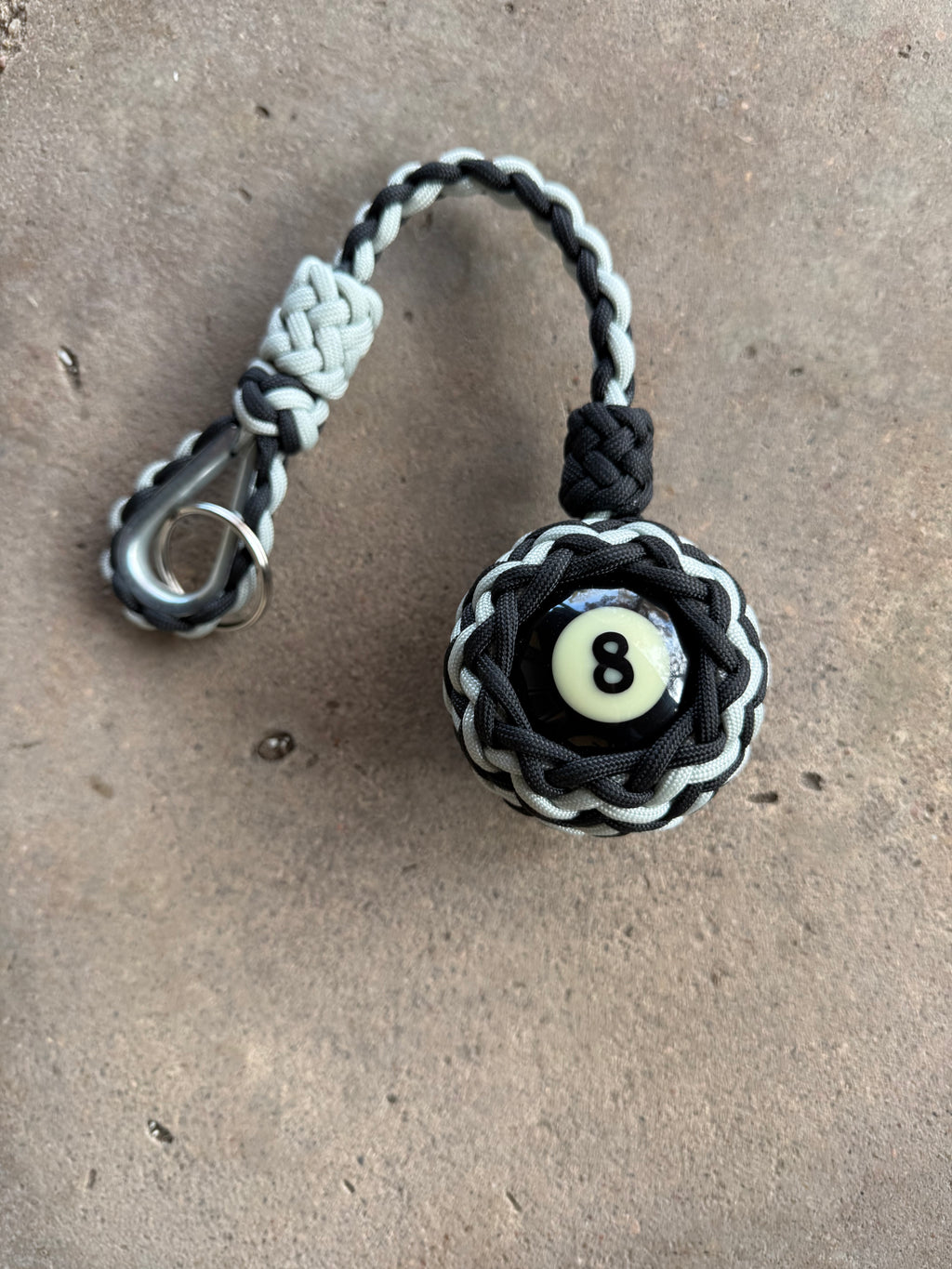 Decorative Paracord Wrapped 8 Ball in Black/Silver paracord on stainless steel thimble monkey fist style keychain