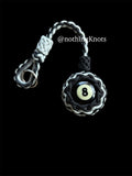 Decorative Paracord Wrapped 8 Ball in Black/Silver paracord on stainless steel thimble monkey fist style keychain