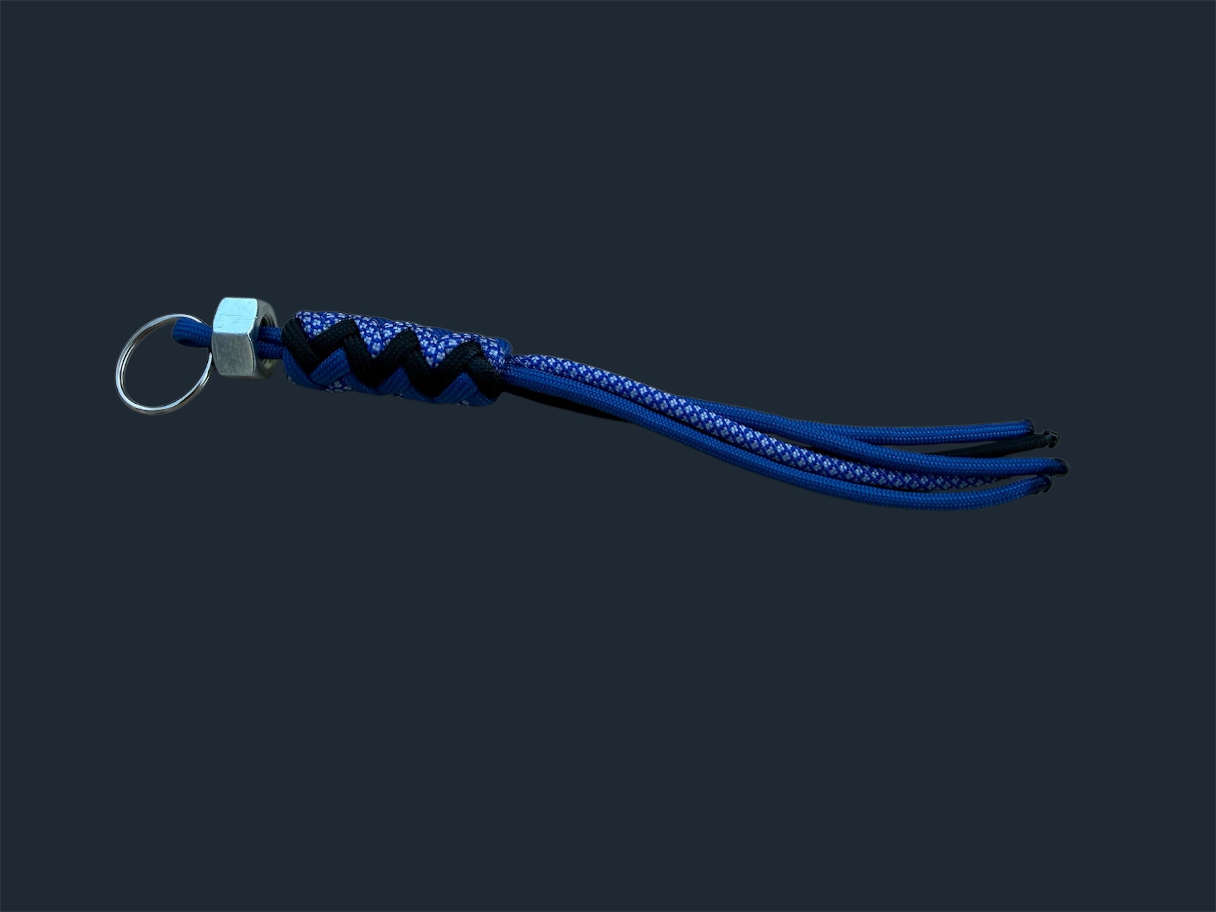 Paracord Decorative Keychain in Blue, Black, and Blue with White Diamonds on a split ring with hex nut