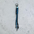 Paracord Decorative Keychain in Black, Blue, and Dark Rainbow on a split ring with hex nut