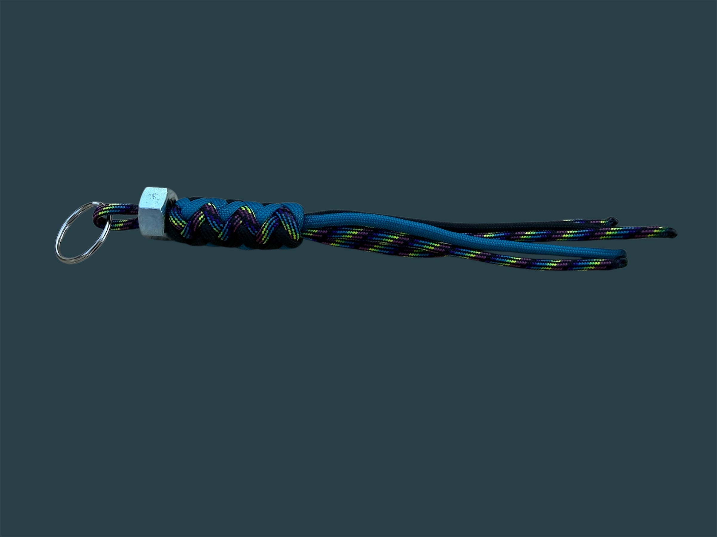 Paracord Decorative Keychain in Black, Blue, and Dark Rainbow on a split ring with hex nut
