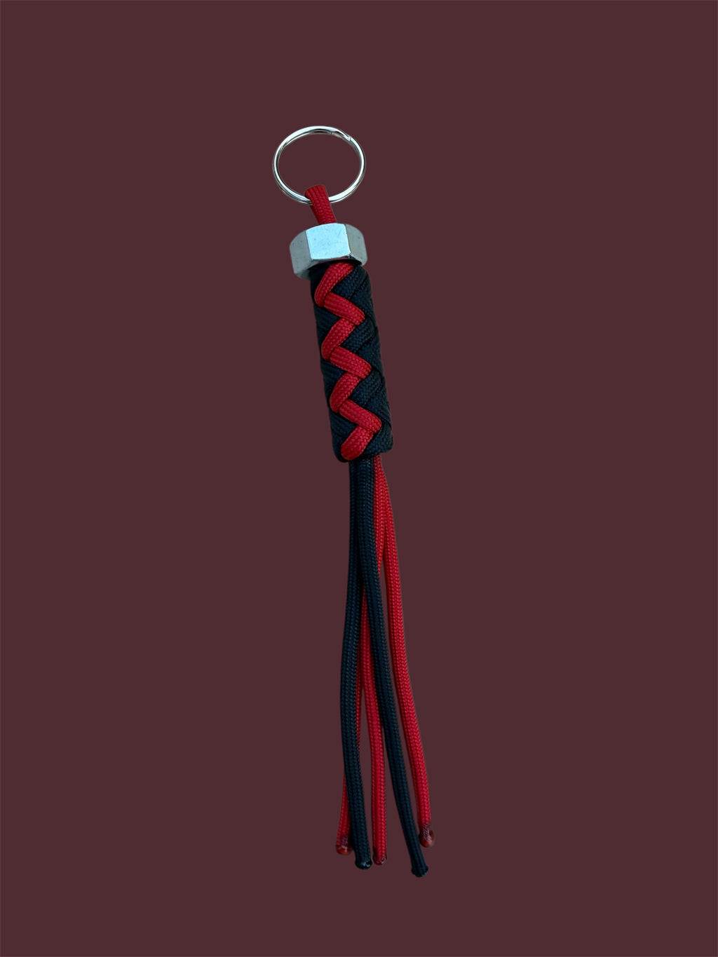 Paracord Decorative Keychain in Black and Red on a split ring with hex nut