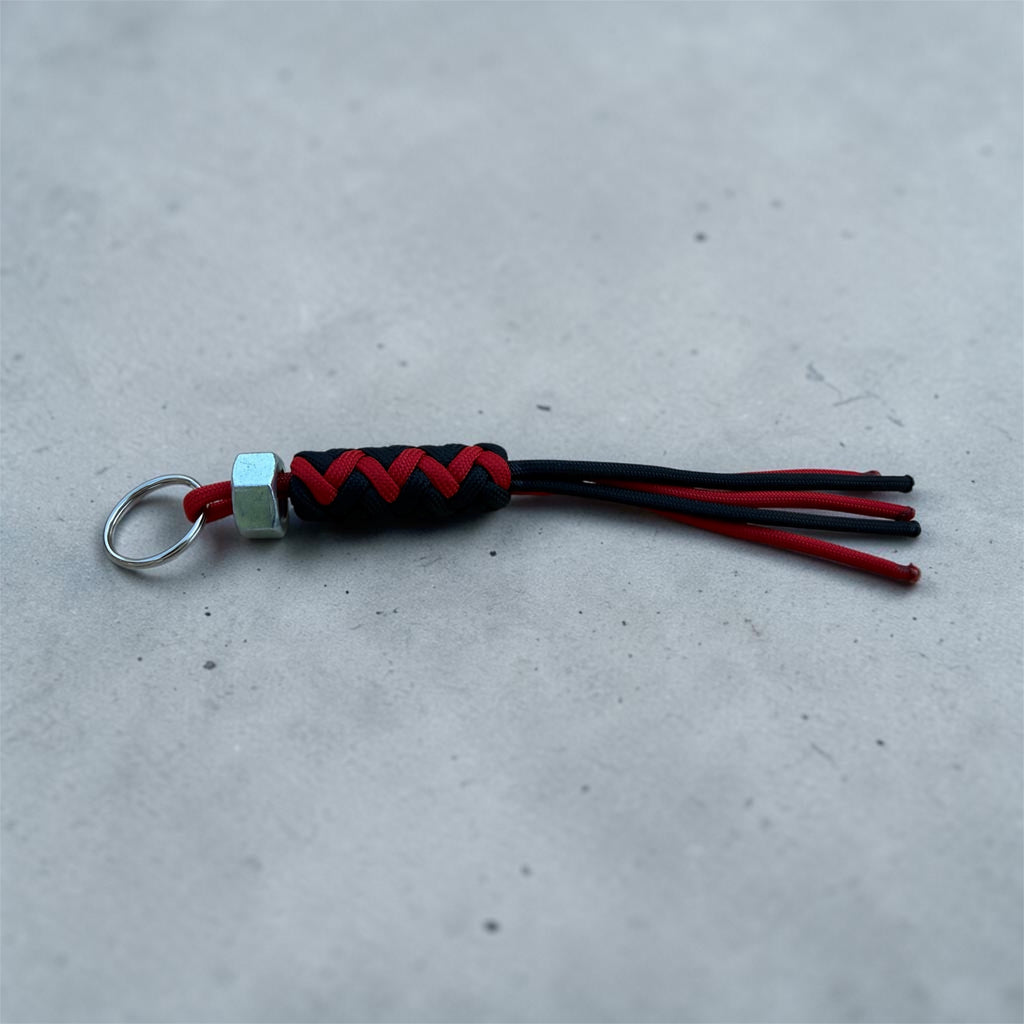 Paracord Decorative Keychain in Black and Red on a split ring with hex nut