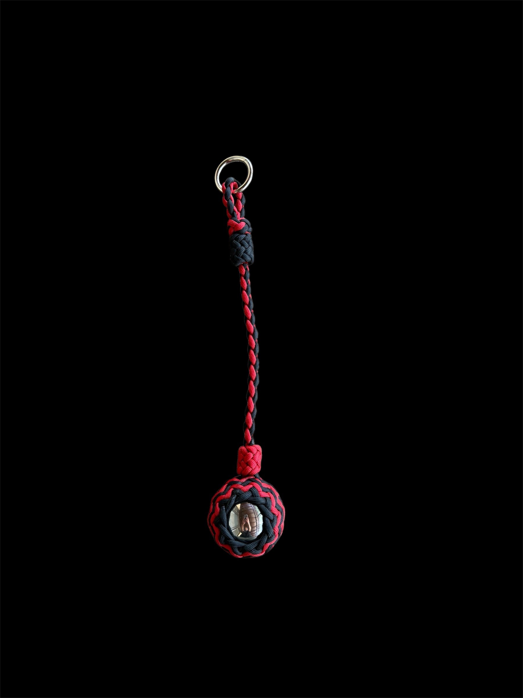 Decorative Paracord Wrapped 2 inch Steel Ball in Red and Black monkey fist style on a silver welded O ring