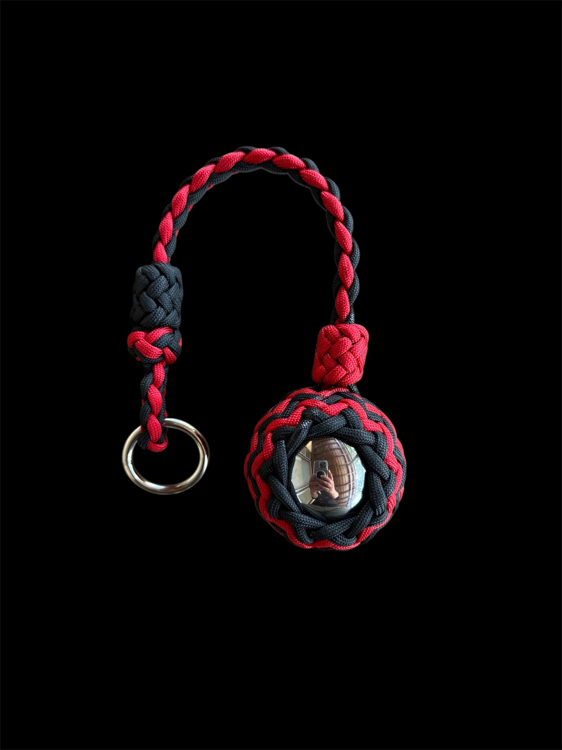 Decorative Paracord Wrapped 2 inch Steel Ball in Red and Black monkey fist style on a silver welded O ring
