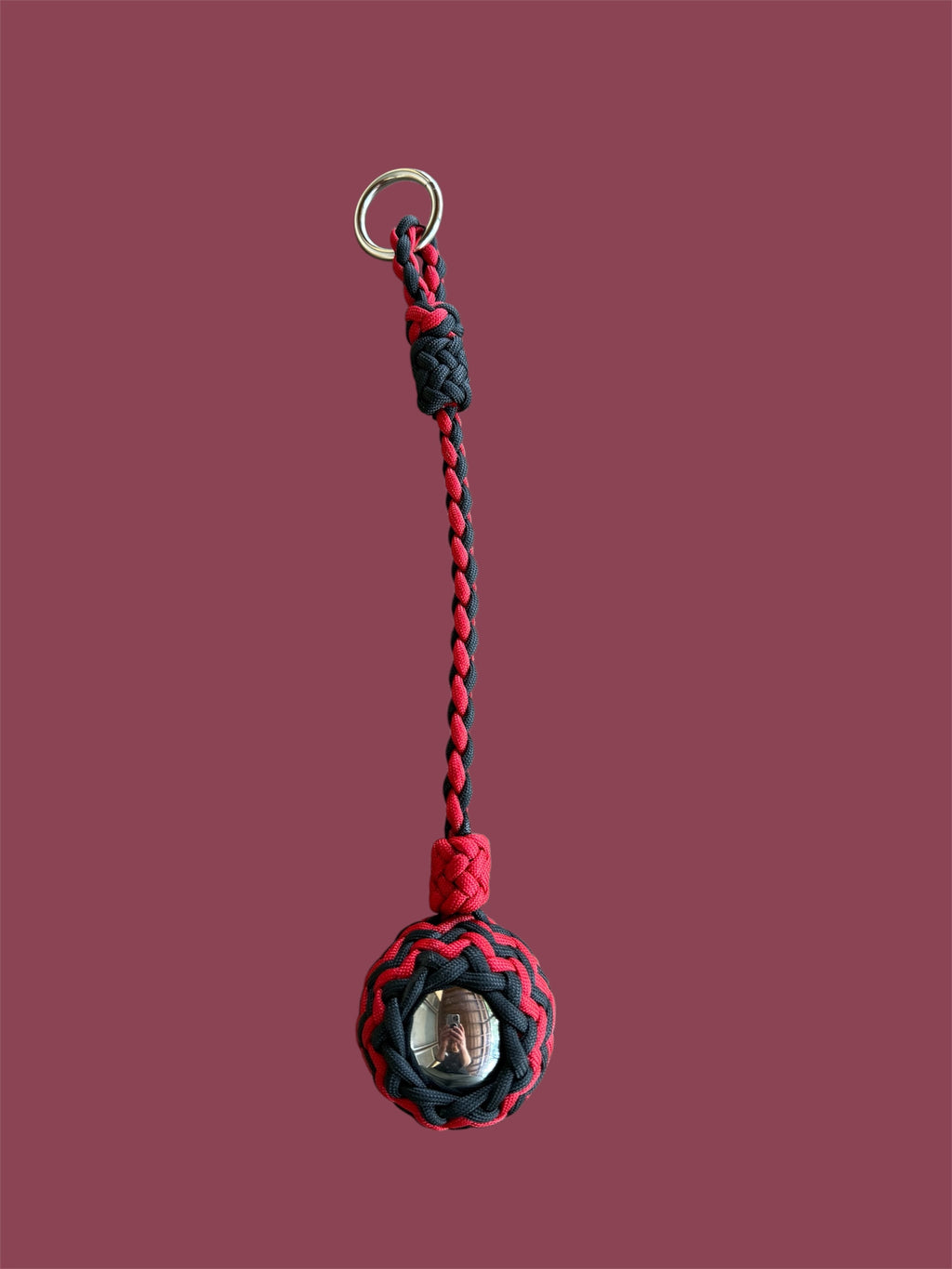 Decorative Paracord Wrapped 2 inch Steel Ball in Red and Black monkey fist style on a silver welded O ring