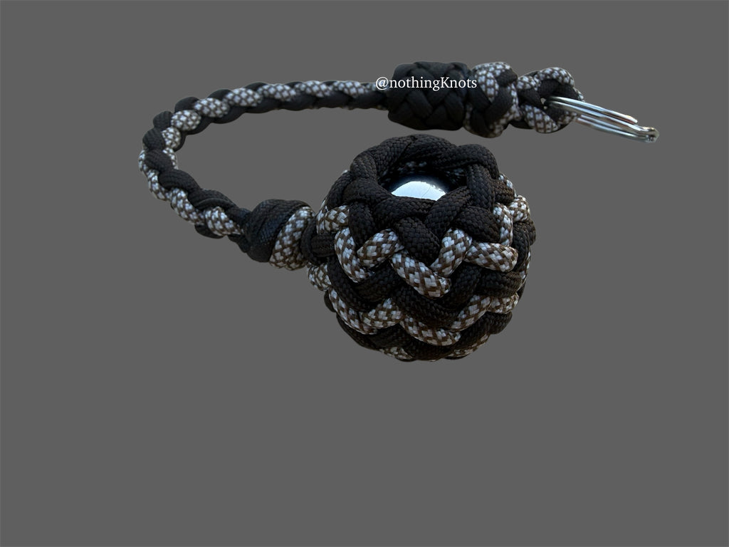 Decorative Paracord Wrapped 1.25 inch Steel Ball in Dark Brown and White with Brown Diamonds Keychain